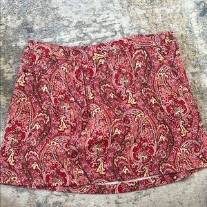 Paisley Print Red golf skort . Side pocket and front zipper pocket